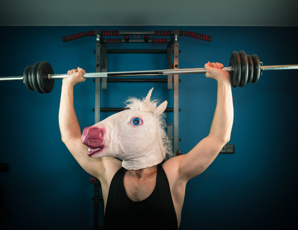 Man lifting weights above his head