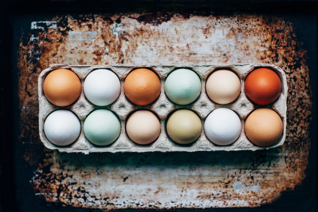 a dozen eggs in a carton
