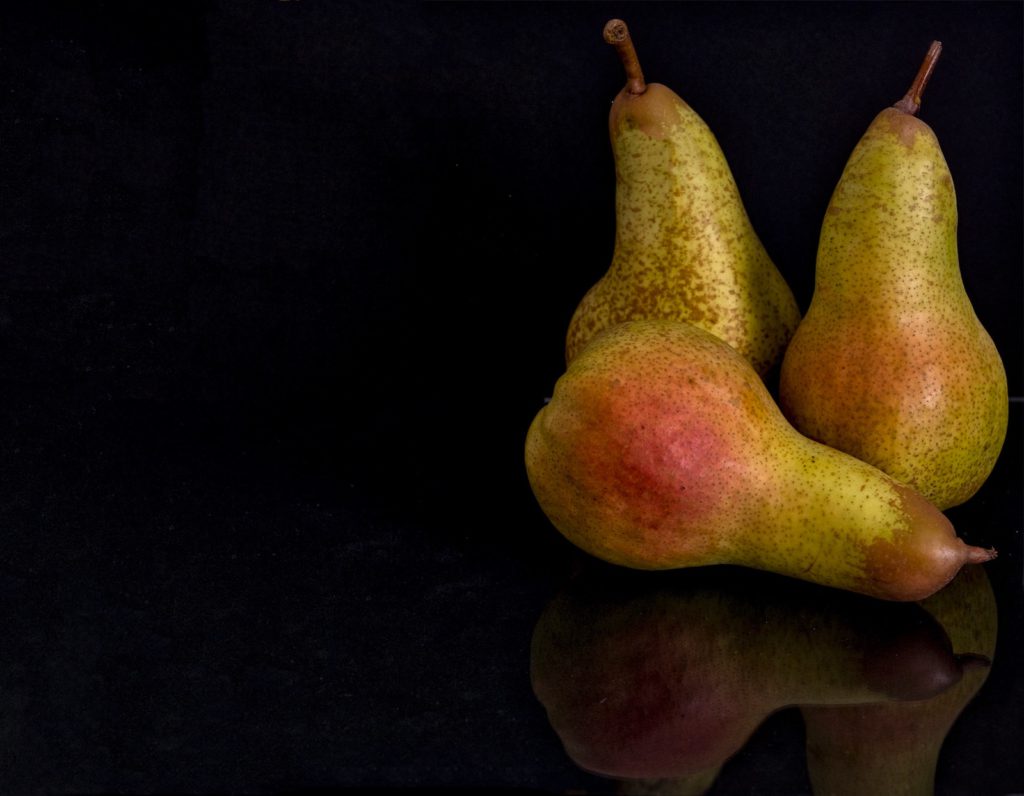 3 pears on a black background