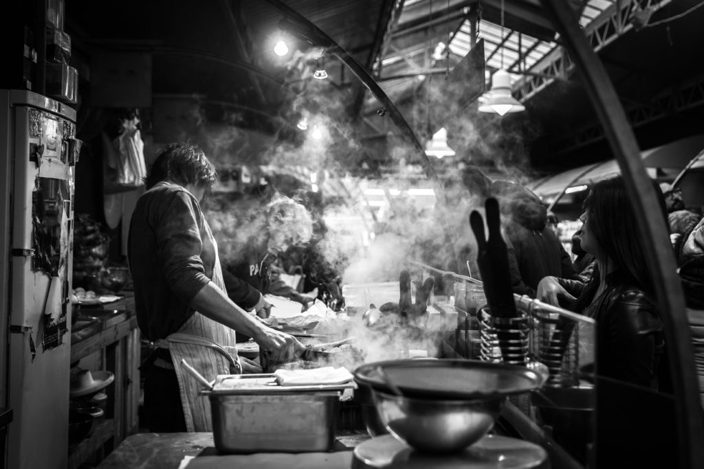 Cooks in a steamy kitchen