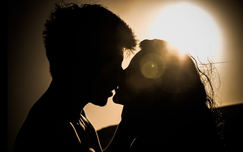 A man and women kissing