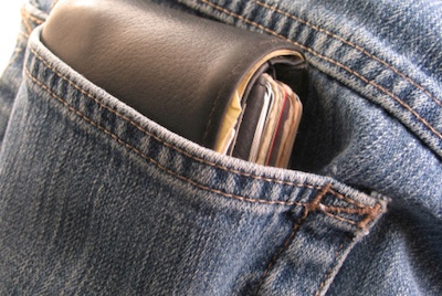 A bulky wallet in jeans pocket.