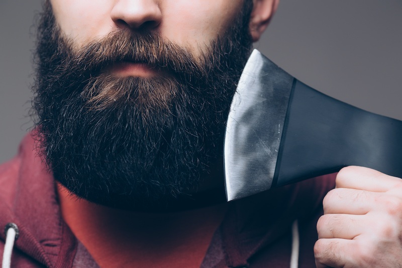 A bearded man holding an axe