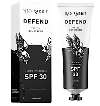 Bottle of Mad Rabbit Defend tattoo sunscreen with SPF 30 protection.