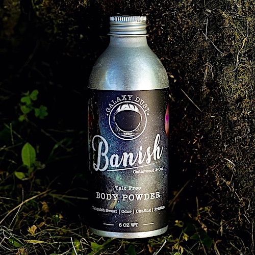 A bottle of Galaxy Dust Banish body powder for men