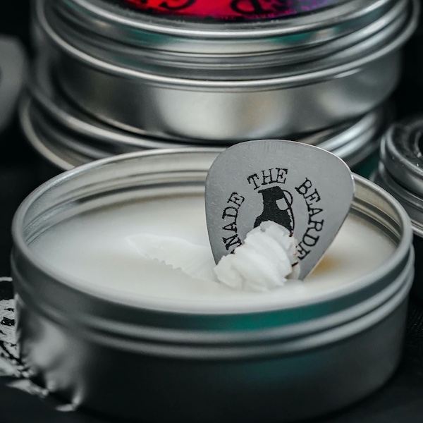 An open tin of beard balm from The Bearded Grenade